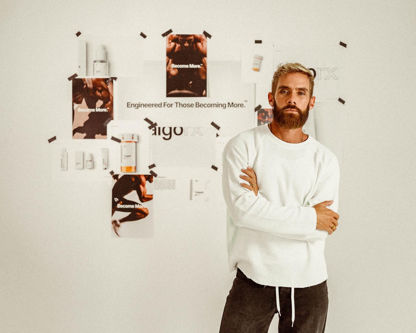 Dr. Hotch in front of the algorx brand wall